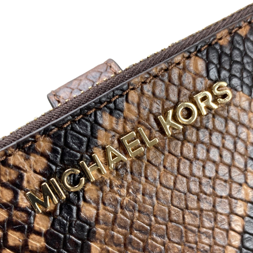 Calvin Klein Brown Snakeskin Clutch Leather ref.318187 - Joli Closet